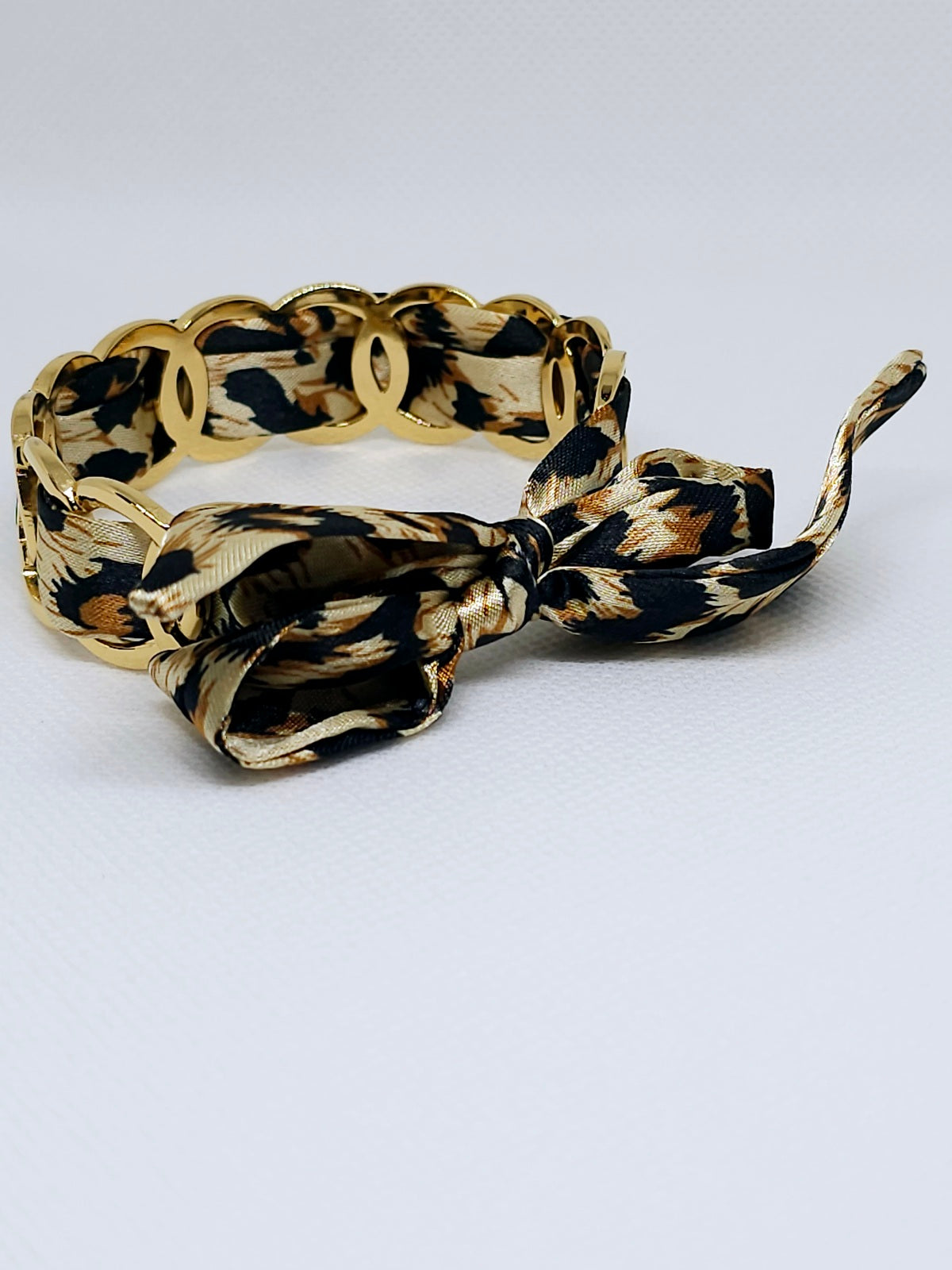 Bracelet tissu léopard et maillons dorés