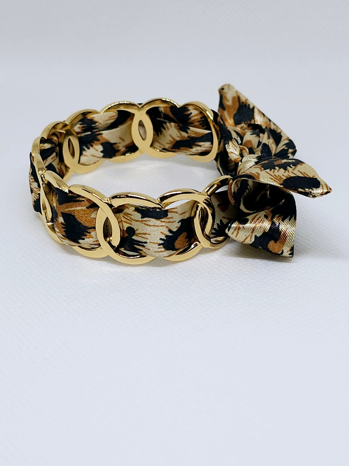 Bracelet tissu léopard et maillons dorés