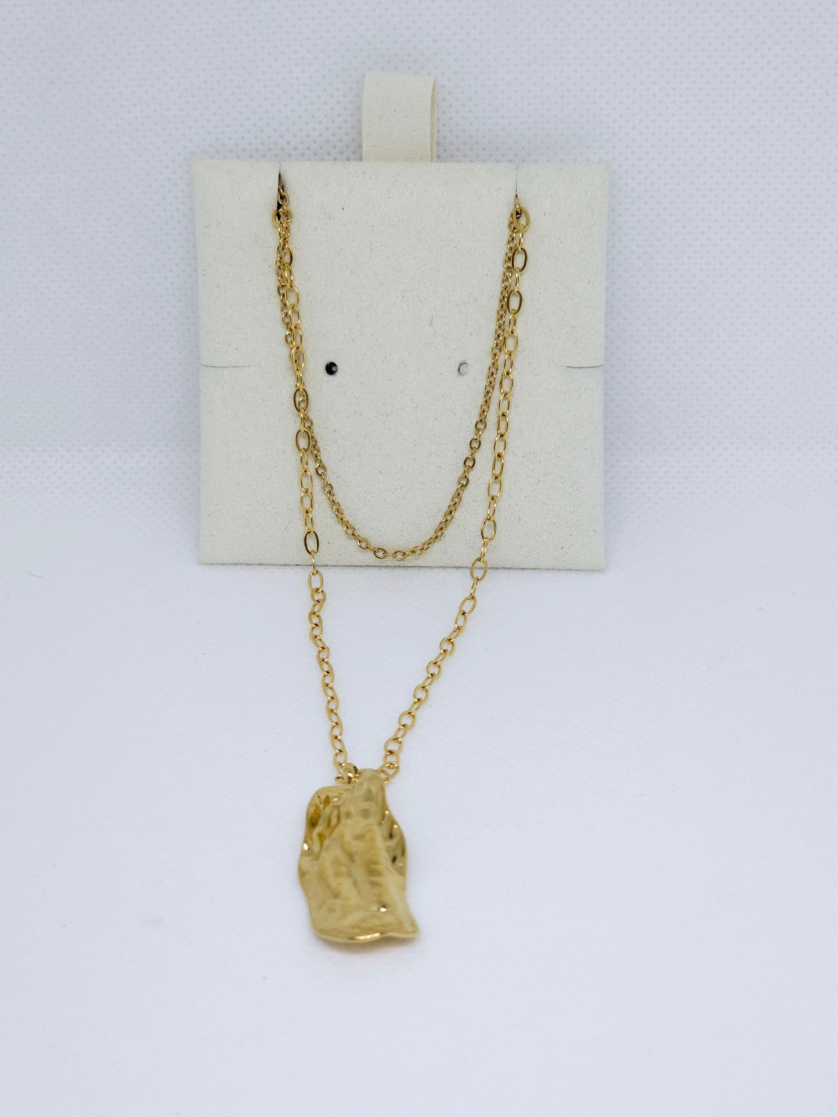 Coffret bijoux dorés design martelé élégant