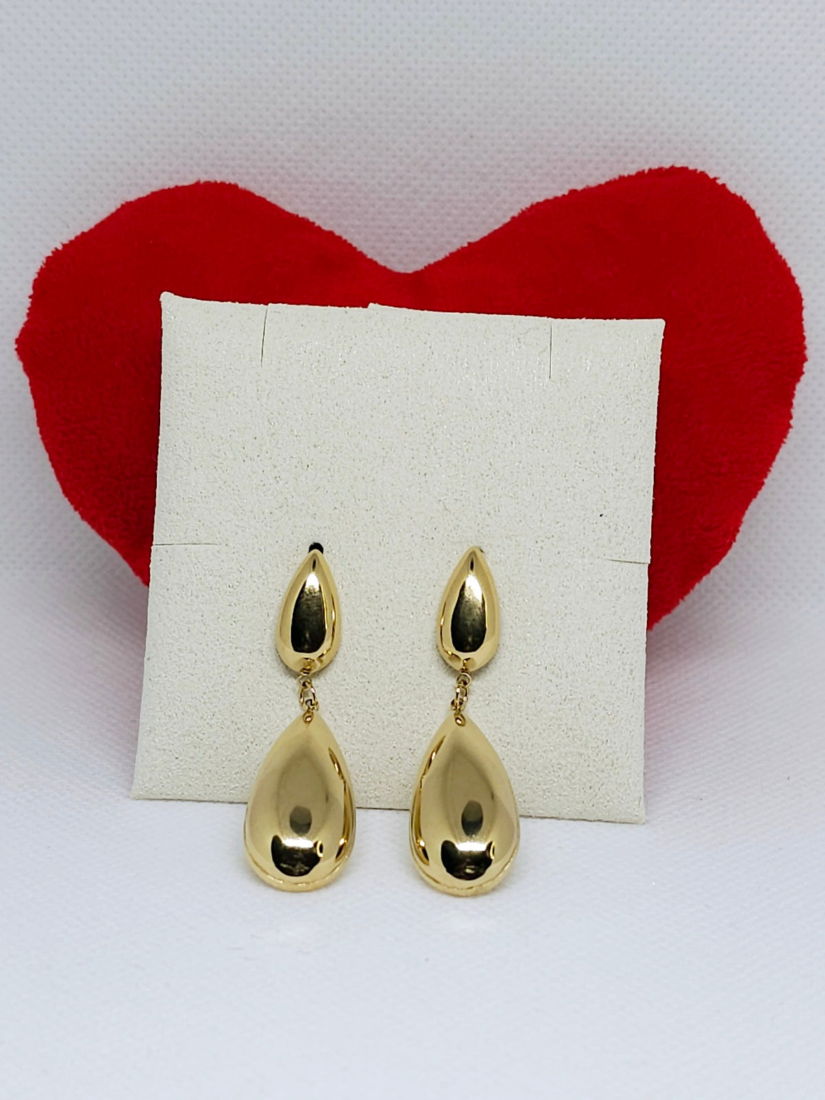 Boucles d’oreilles Calypso dorées élégantes.