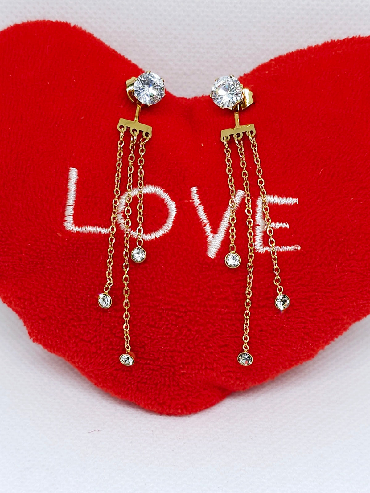 Boucles d'oreilles dorées à chaînettes brillantes