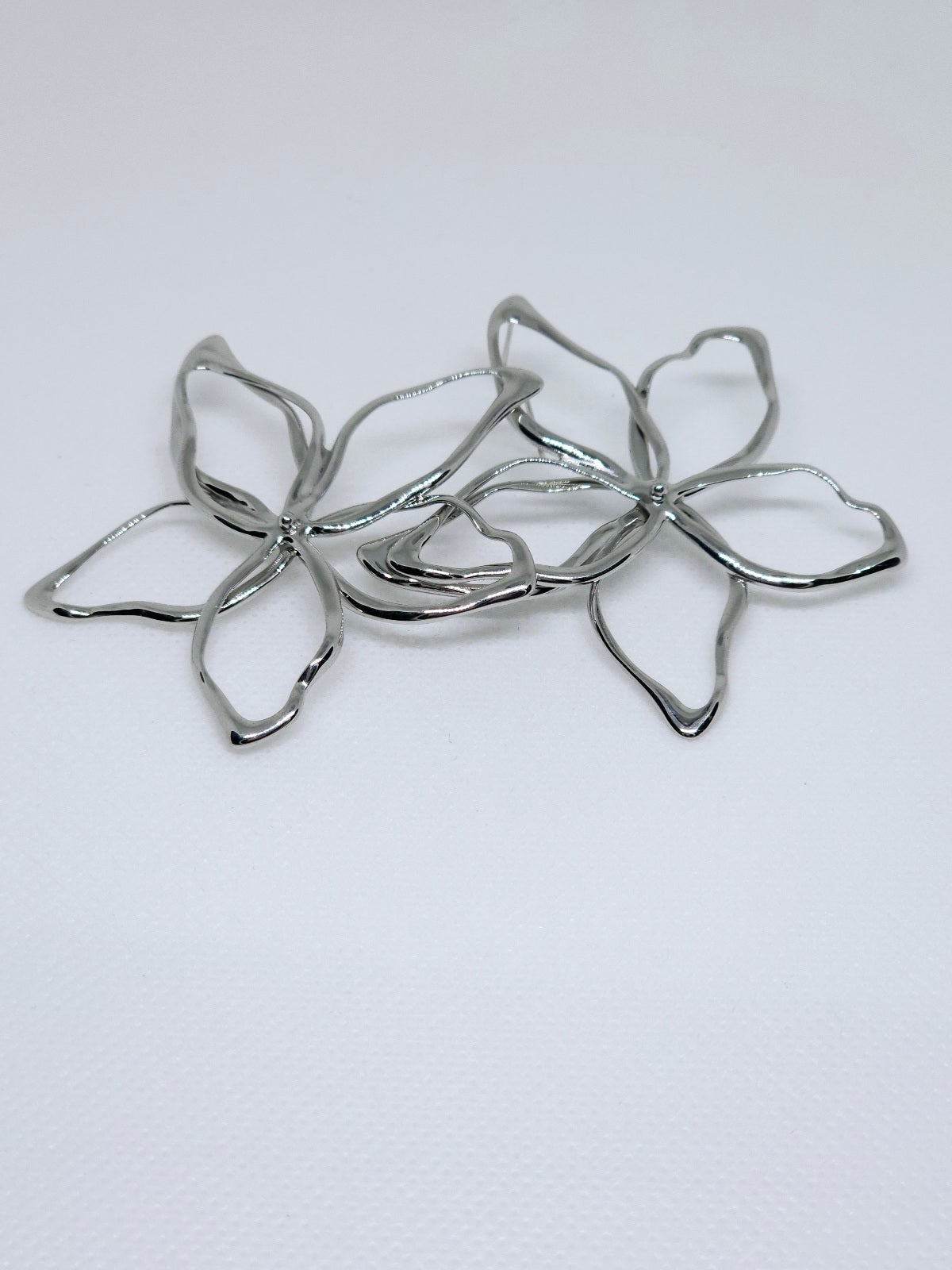 Silver Blossom Aura™ Statement Earrings