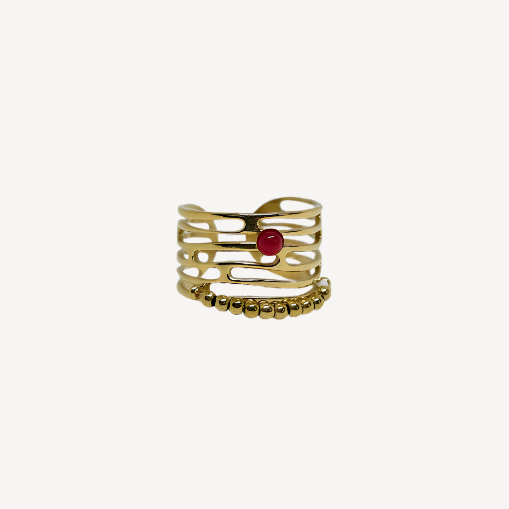 Bague élégante dorée pierre rouge