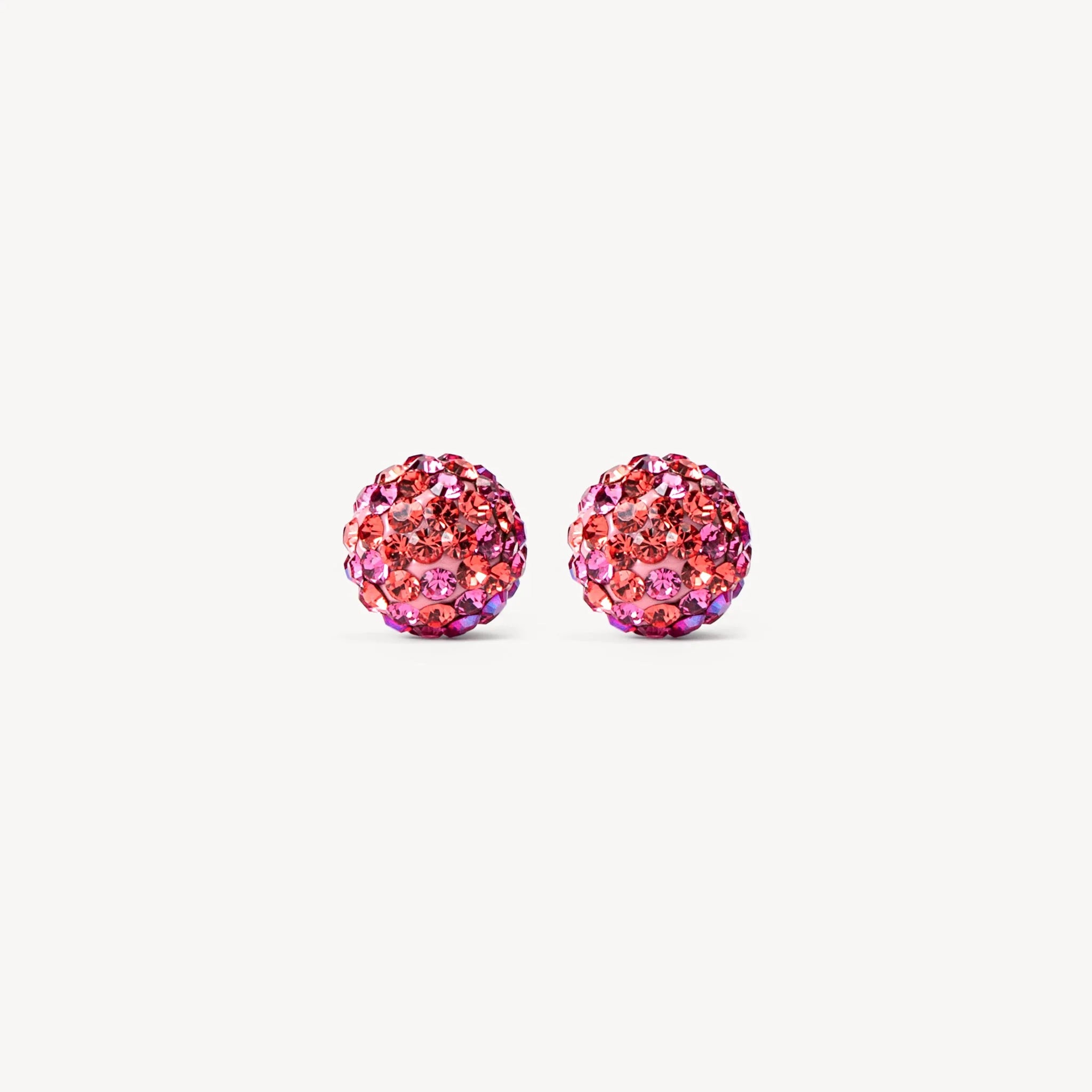 Boucles d’oreilles clous sphériques roses scintillantes effet floral.