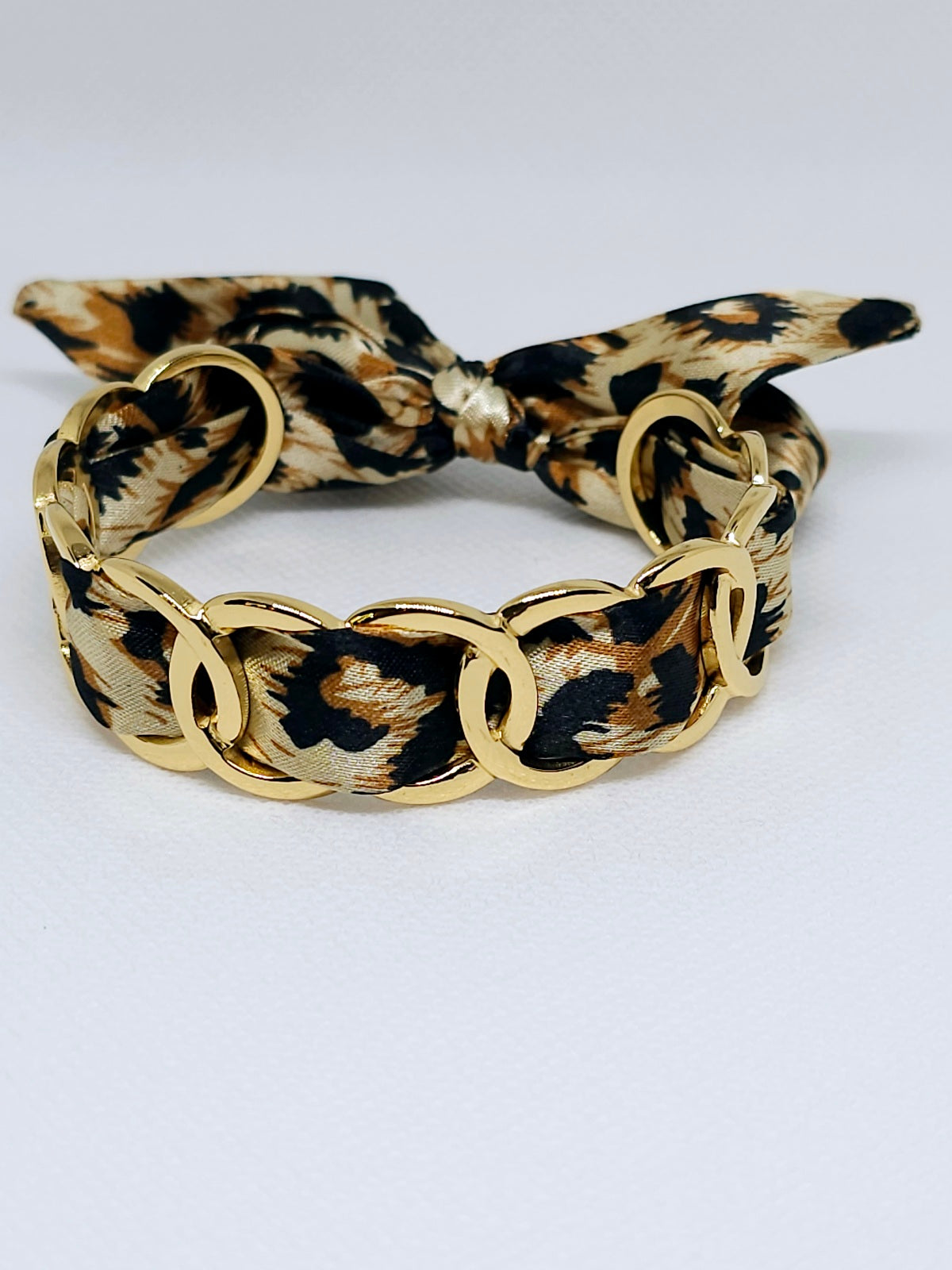 Bracelet tissu léopard et maillons dorés