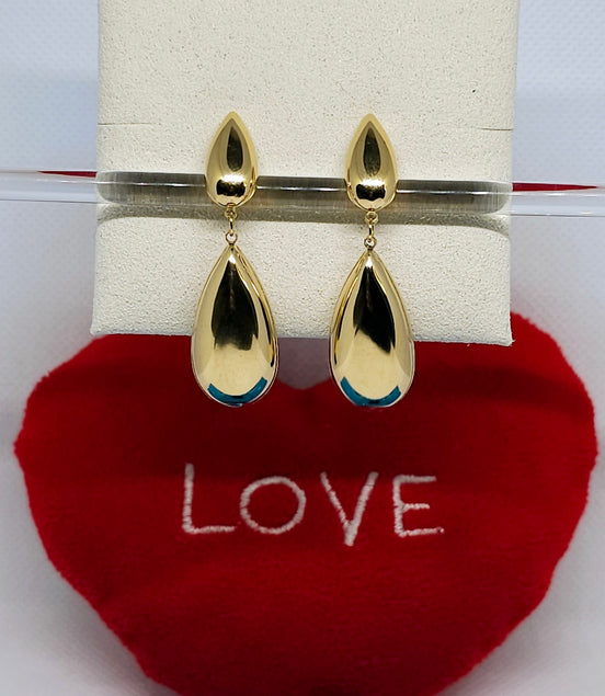 Boucles d’oreilles Calypso dorées élégantes.