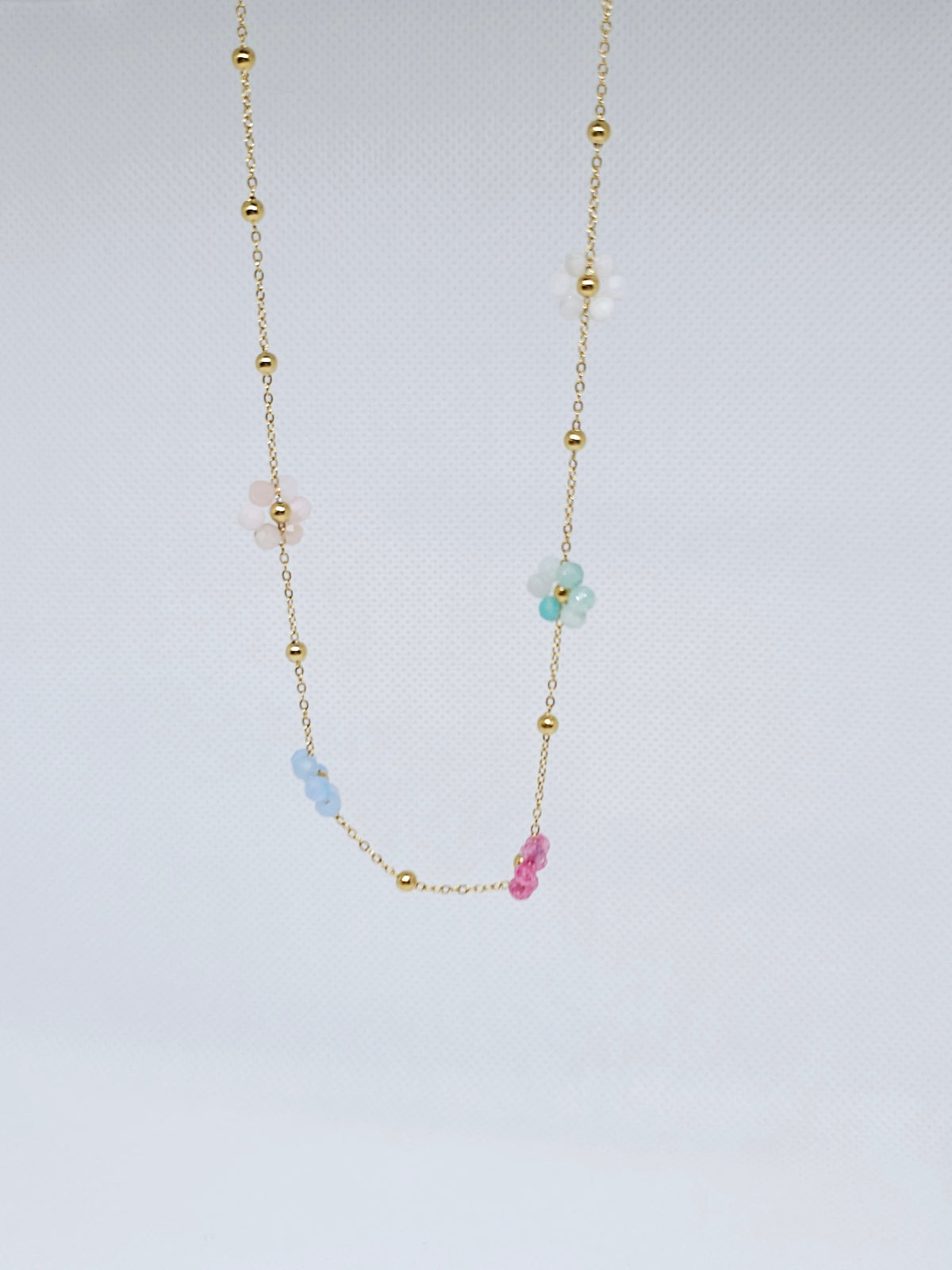 Collier fleurs perles multicolores doré