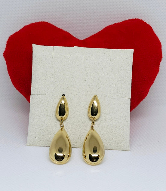 Boucles d’oreilles Calypso dorées élégantes.